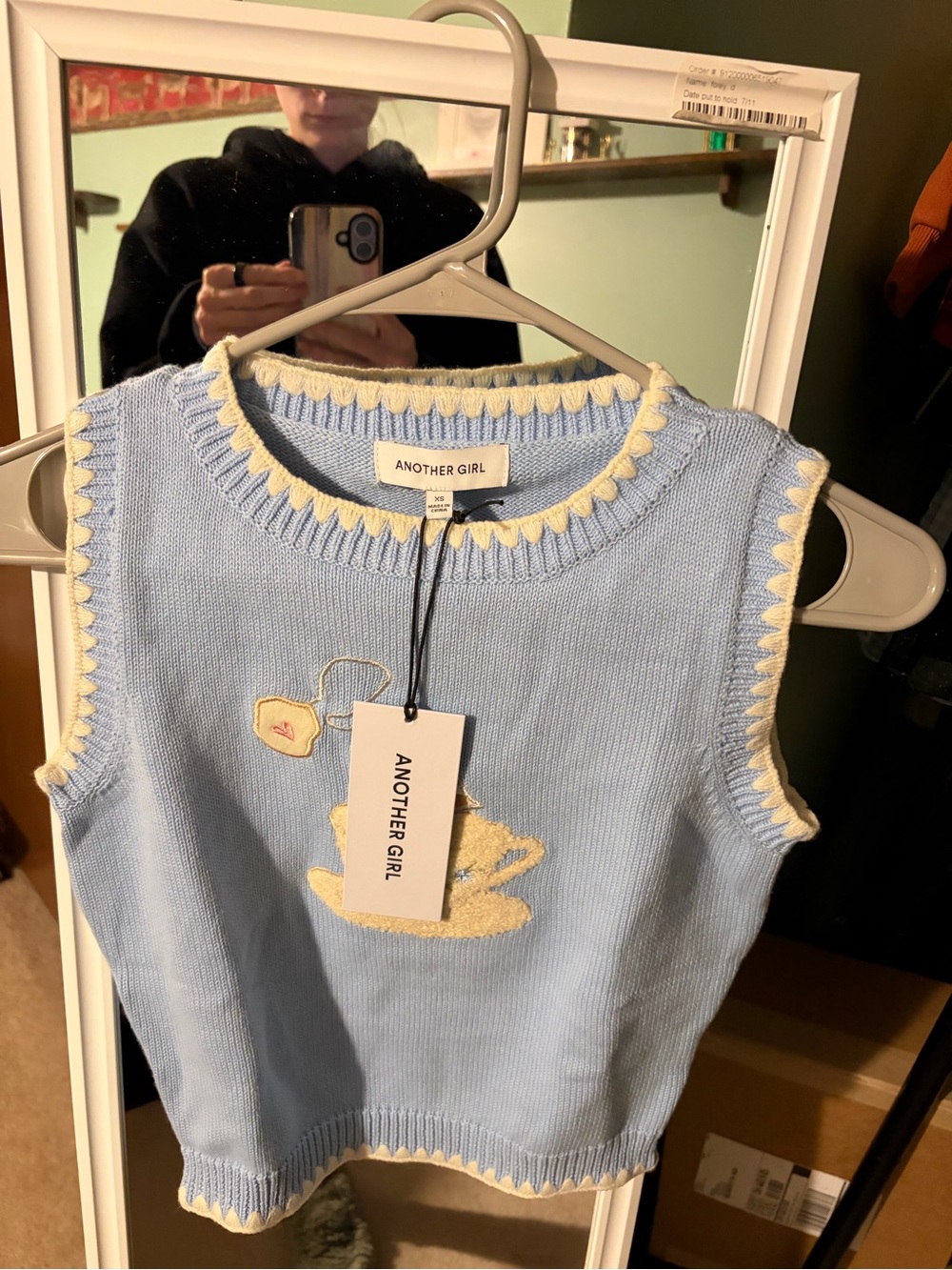 Women's Blue Tea Cup Knit Sweater Vest. Another girl